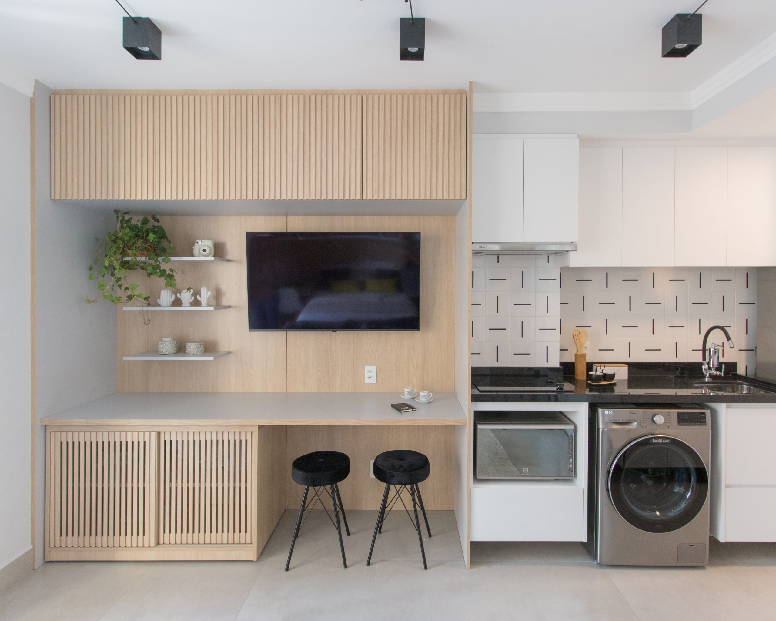 espaço integrado de sala, cozinha e lavanderia