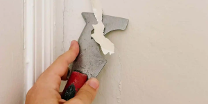 remover tinta descascada da parede