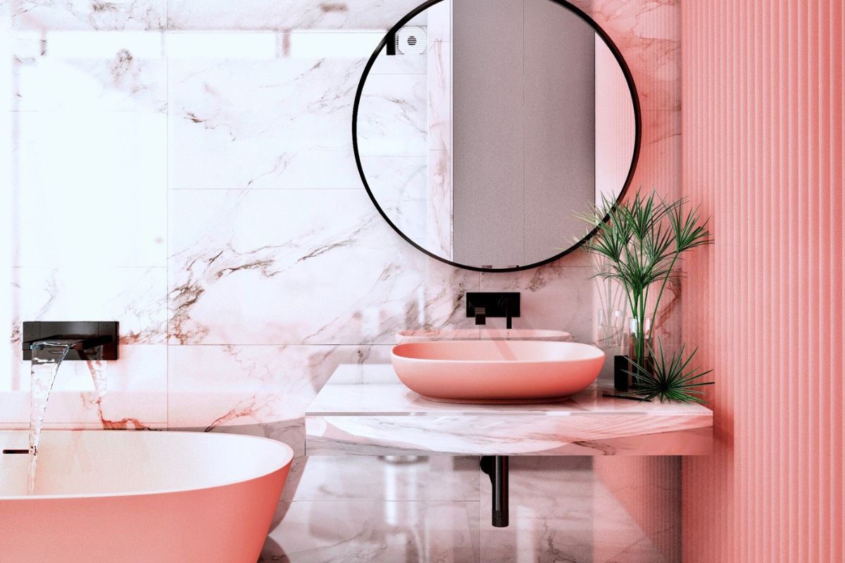 banheiro em tom de rosa com espelho redondo