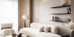 sofa curvo bege com tapete retangular